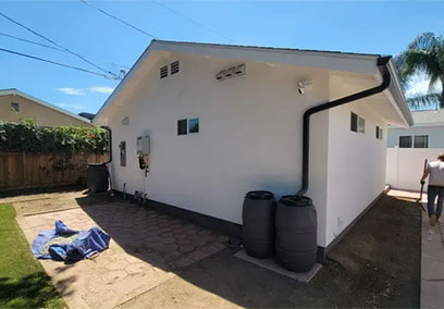 White Residential Building Exterior with Guttering and Side Yard in West Hills CA